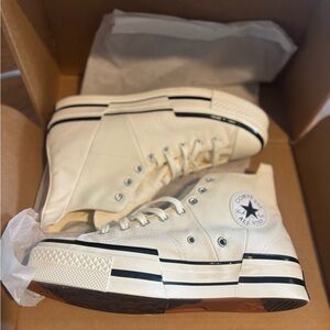 Converse Chuck Taylor All Star High-Tops Men’s 10.5, Women’s 12.5.